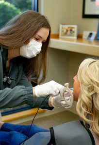 examining a patient lexington dental of owasso