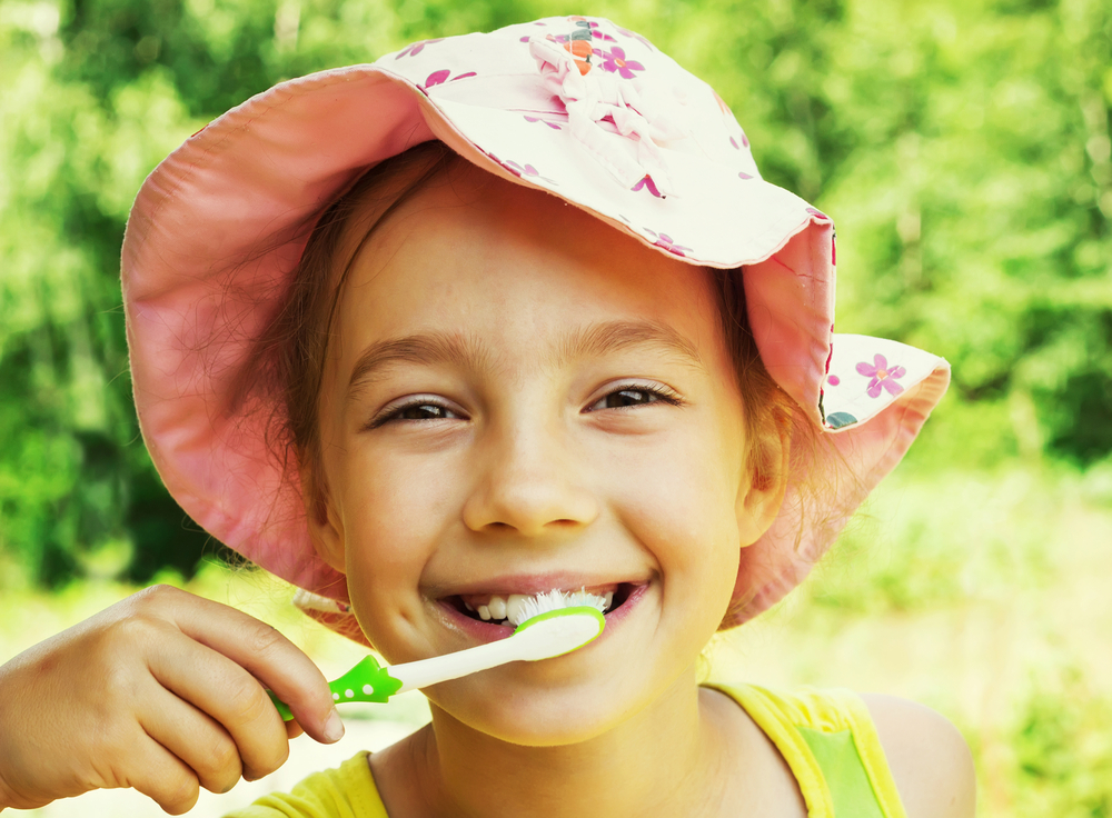 child brushing teeth