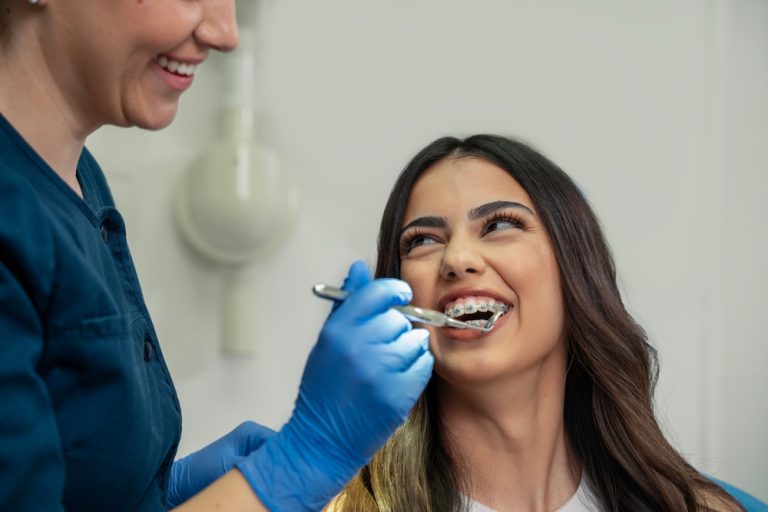 woman being examined at the dentist