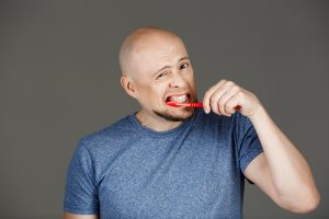 man overbrushing