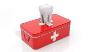 Dental emergency kit with a tooth and first aid supplies for festival season.
