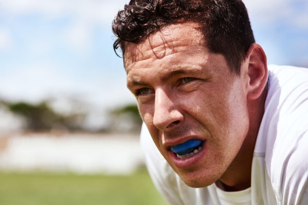 Collision,Sport,Requires,A,Bit,Of,Extra,Protection.,A,Young sports mouth guard